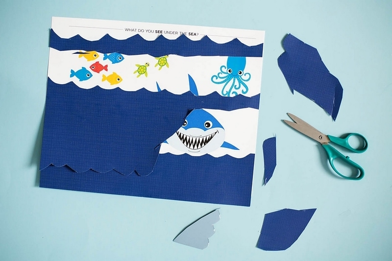 Ocean activities for preschoolers like this cutting craft help promote fine motor skills.
