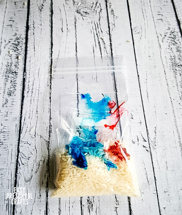 Rice and food coloring in a plastic bag